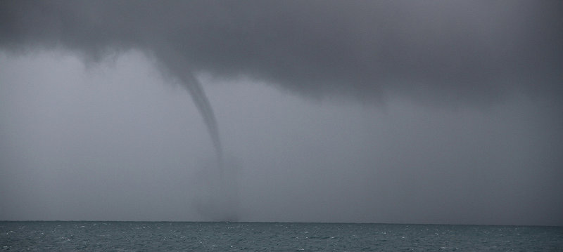 A water spout formed in the distance.