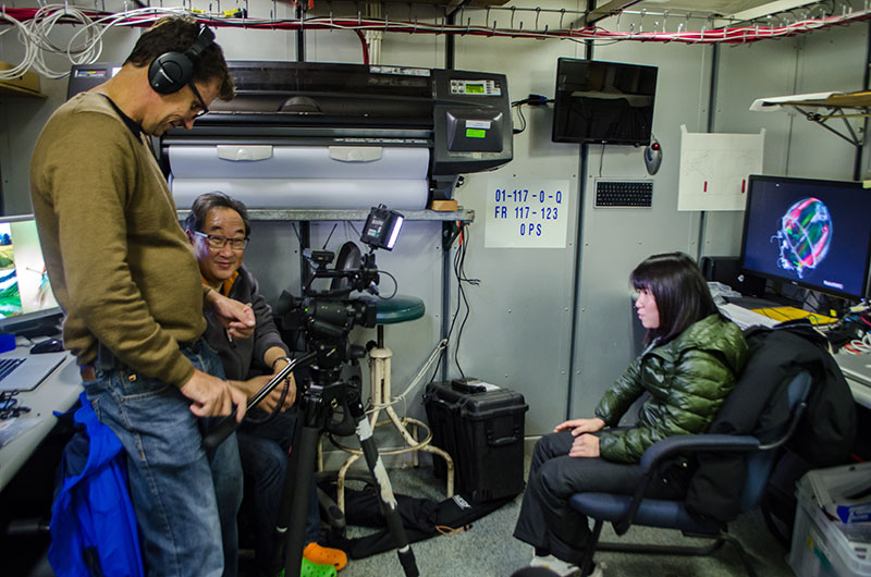 Michael Aw and Stuart Ireland from Ocean Geographic interview student Yui Takagi for their documentary.