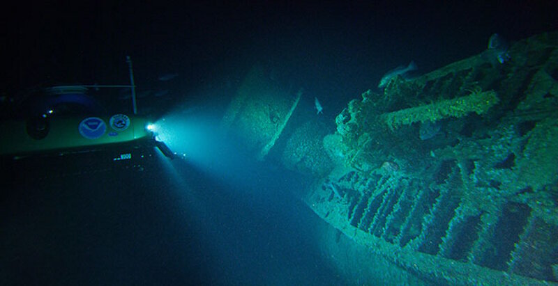 During the very first dive of the expedition, scientists located and explored the German U-576. This was the first time since the submarine was sunk on July 15, 1942, that anyone had laid eyes on the vessel. Here, Project Baseline's Nemo submersible shines its lights on the U-boat lying on its starboard side, showing the submarine's conning tower and the deck gun in the foreground. Image courtesy of John McCord, UNC Coastal Studies Institute - Battle of the Atlantic expedition.