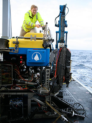 Carl, on his first cruise in 2010, works on remotely operated vehicle Jason aboard NOAA Ship Thompson.