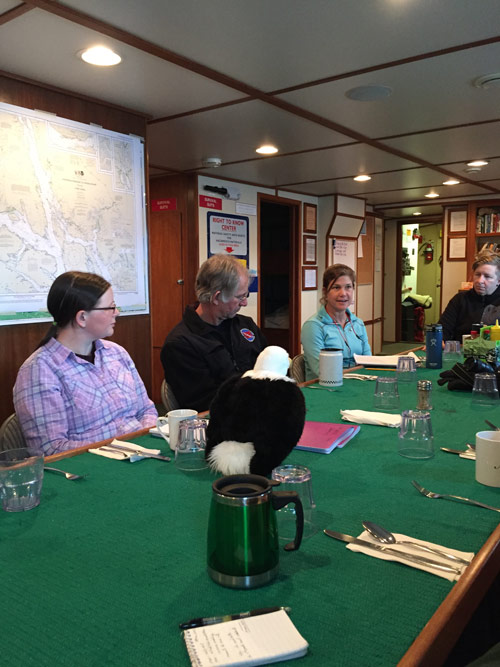 Qanuk listens in on daily science meeting.