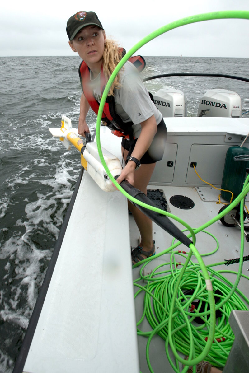 National Park Service archeologist ready to deploy the magnetometer during survey operations.