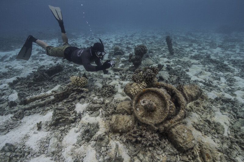 Jason Leonard photographs the remains of the radial engine from the Brewster Buffalo fighter plane.