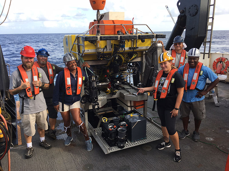 Left to right: AB Brendan Garvey, GVA Jason Gosine, BGL Leslie Allen, AB Tracy Sorgenfrei, AB Denek Salich, and CB Greg Walker readying the remotely operated vehicle (ROV) Odysseus for deployment.