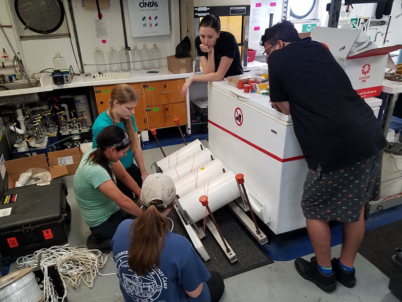 The Hamdan lab group works together and brainstorms with primary investigator and chief scientist, Leila Hamdan, to make sure that the MREs and bundles of line are arranged in a specific configuration, so that they will deploy correctly at the shipwreck site Anona.