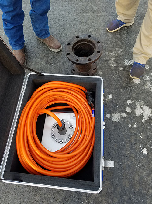 The parametric sonar sensor and data cable (in box) with the flange adapter that will be cut and welded to fit the sensor’s bolt pattern.