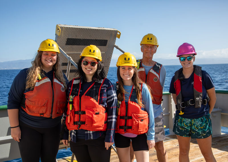 Kirstie Francis, Carol Kim, Courtney Brooks, John Reed, and Madison Lytle (left to right) pose with their protective gear as they get ready to launch the remotely operated vehicle.