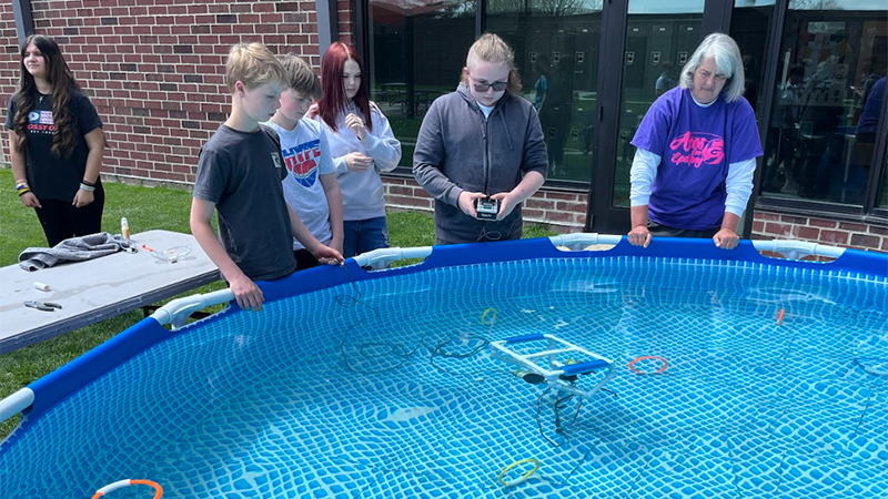 Greenon Junior/Senior High School 8th graders pilot an ROV during their engineering design challenge.