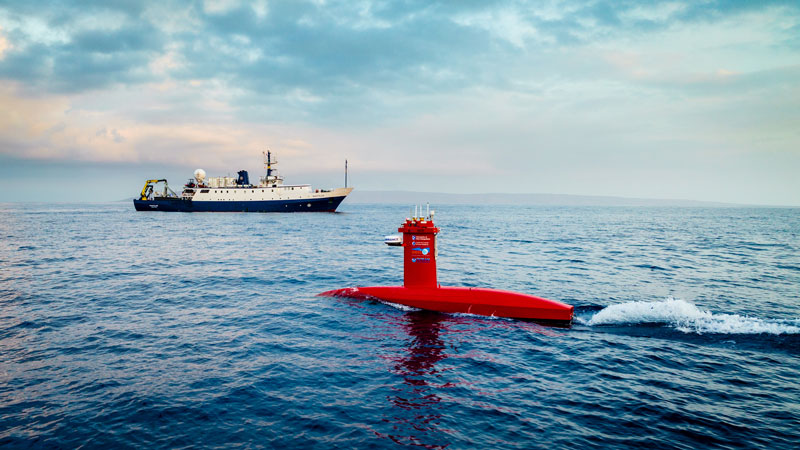 Exploration Vessel Nautilus and the autonomous surface vessel DriX map and survey in tandem during an expedition.