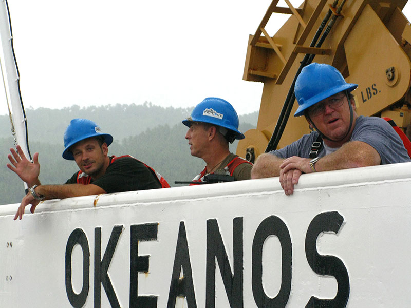 Crewmembers Liam Vickers, Jeff Brawley, and James Deeton await the ship's arrival in Bitung, Indonesia. 