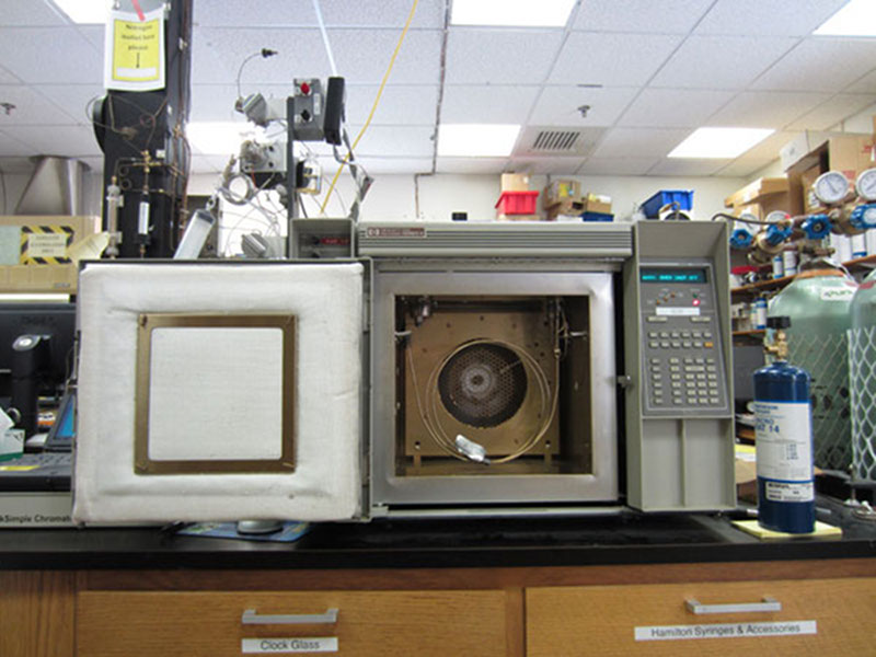 A sample has just been injected into the gas chromatograph using the syringe.  The hydrogen has passed through the column and detector and is visible onscreen as a peak in the graph.  Since it is a larger molecule than hydrogen, the methane peak will appear next.