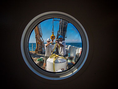 Crew members BGL Jerrod Hozendorf (left) and AB Kelson Bracey aboard NOAA Ship Okeanos Explorer prepare for the 2013 Northeast U.S. Canyons Expedition.