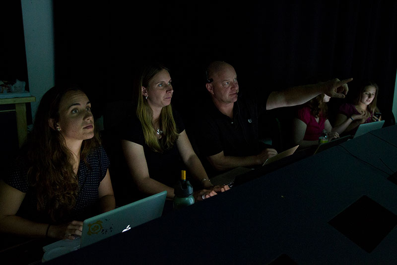 Telepresence provides many opportunities, including training the next generation of scientists. Here, Tim Shank, Co-science team lead for this cruise, and several of his students join the expedition from the Inner Space Center.