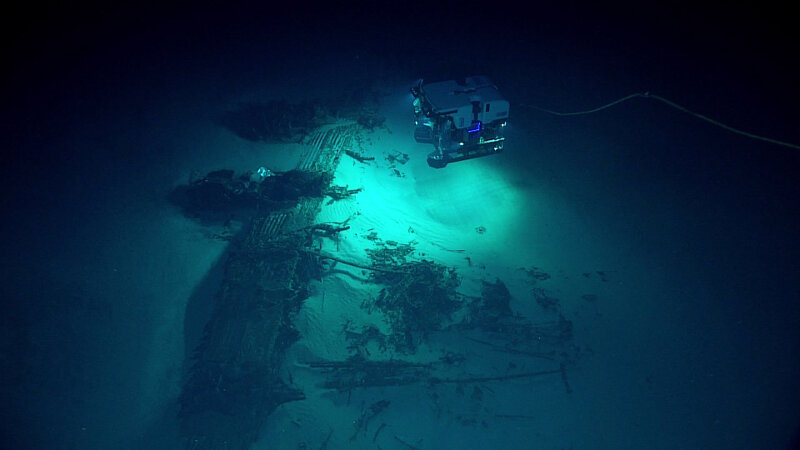 Between 2015 and 2017, we led the ‘Campaign to Address Pacific monument Science, Technology, and Ocean NEeds (CAPSTONE),’ a major multi-year foundational science effort that enhanced our understanding of deepwater areas of U.S. marine protected areas in the central and western Pacific. In this image, remotely operated vehicle Deep Discoverer surveys a B-29 Superfortress aircraft resting upside down on the seafloor. This was the first B-29 crash site found of over a dozen American B-29s lost in the area while flying missions during World War II.