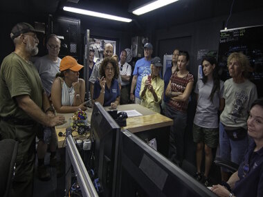 Science team co-lead, Shirley Pomponi, discusses the upcoming mission during a ship tour of local stakeholders and resource managers.