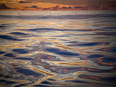 The water is so calm, it is hard to believe that the nearest land is more than 400 nautical miles away; it looks more like a painting than reality.