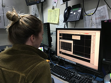 Mapping lead Lindsay McKenna works on troubleshooting the multibeam.