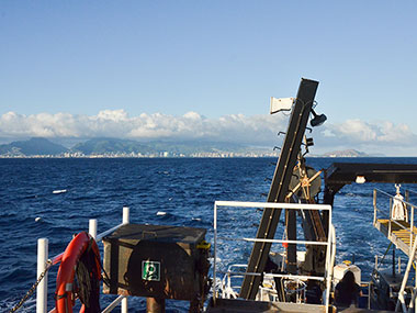 Image of the starboard aft deck of NOAA Ship Okeanos Explorer leaving Oahu and beginning a more than two-day transit to the Johnston Atoll Unit of the Pacific Remote Islands Marine National Monument.