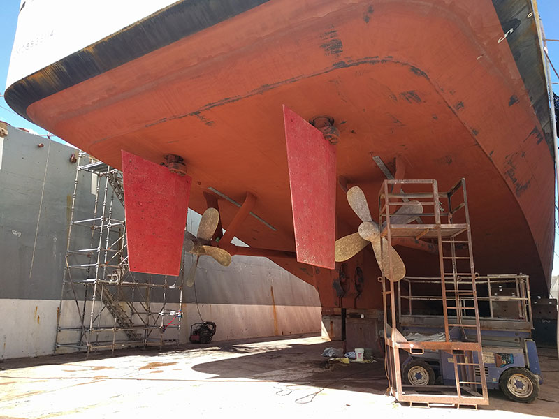 The Okeanos Explorer has two large rudders that steer the ship while underway. These rudders turn together in the same direction and are controlled by two steering pumps. The steering pumps receive input from the bridge through a controller and turn the rudders accordingly. The controller unit received calibration to ensure that the proper rudder angle is used.