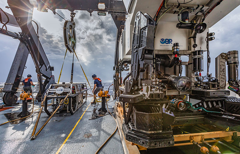 The team preps for the first remotely operated vehicle dive of the mission on a cloudy morning.