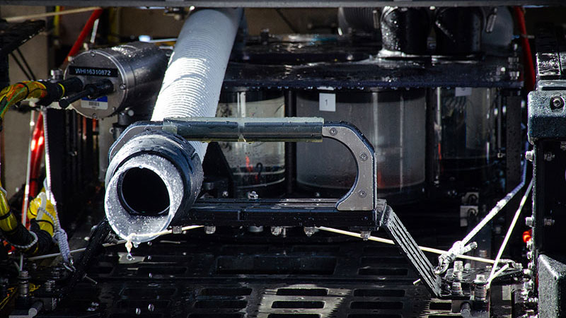 Close up of the new suction sampler and the rosette of sample jars on the remotely operated vehicle Deep Discoverer.