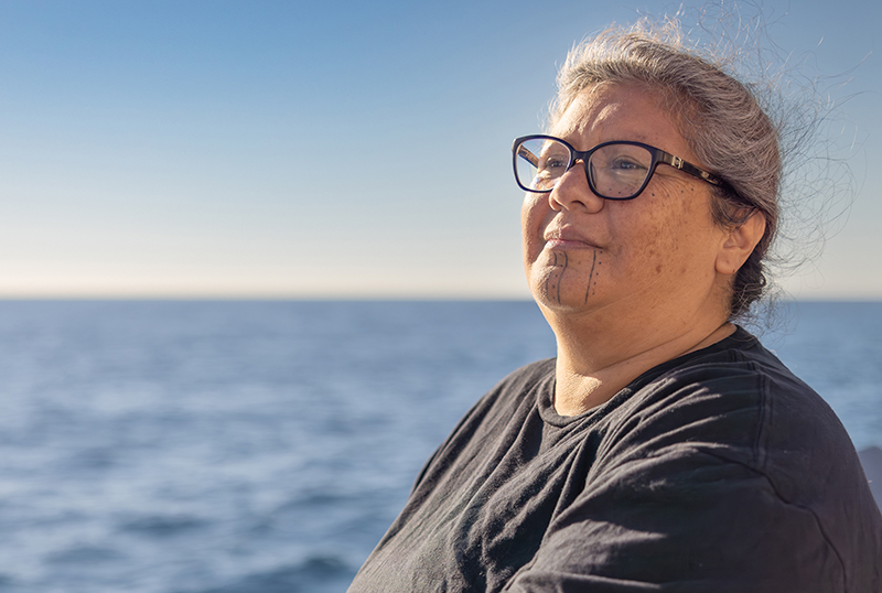 Mia Lopez of the Coastal Band of the Chumash Nation looks out on her ancestral waters from the deck of NOAA Ship Okeanos Explorer during the 2023 EXPRESS: Exploration of Central California Coast expedition.