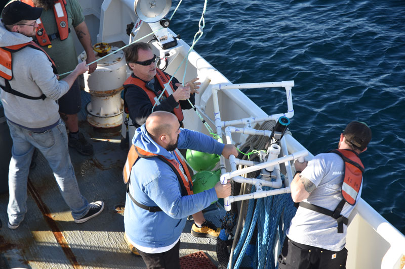 The Maka Niu camera module and light module, attached to one of the tested PVC configurations, are brought back on board by the crew of NOAA Ship Okeanos Explorer during the 2023 EXPRESS: West Coast Exploration (AUV and Mapping) expedition.