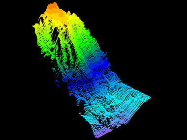 A point cloud of the seamount mapped during the Seascape Alaska 1: Aleutians Deepwater Mapping expedition, generated from acoustic data collected via multibeam echosounder. The hot colors (red, orange, and yellow) represent the newly mapped peak of the seamount at a depth of 895 meters (2,936 feet), while the cold colors (purple, teal, blue) represent the base of the seamount at a depth of around 4,000 meters (13,123 feet).