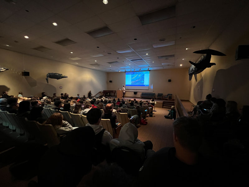 Expedition Coordinator Sam Candio presents to students during the first annual Seward Marine Science Symposium in Seward, Alaska, after the completion of the Seascape Alaska 5 expedition.