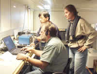 Chris Fox, Sara Bazin and Haru Matsumoto acoustically querying the instrument.