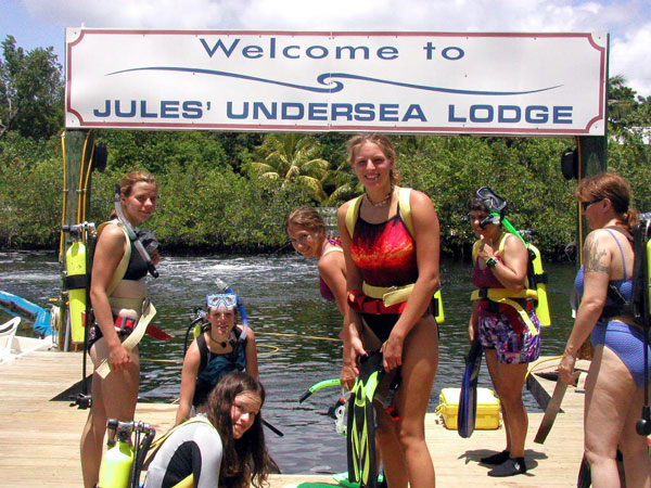 Girl Scouts readying their gear to SCUBA dive to the Jules Verne Undersea Lodge.